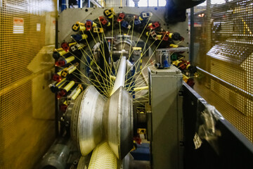 A machine in a factory is actively producing polyvinyl chloride pipe, showcasing various components...