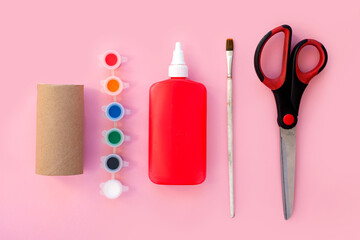 DIY crafts for kids, toilet tube roll, glue, paper, scissors, paint and brush. How to make Christmas, Halloween, Easter, School day toys concept. eco, zero waste. handmade flat lay composition