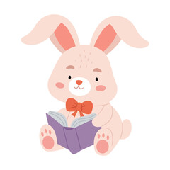 A cute plush rabbit with a bow is holding a book in his paws.I love reading. Funny bunny with book.