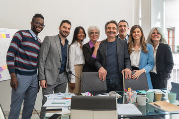 Team diversity celebration in modern startup office with multiethnic business professionals...