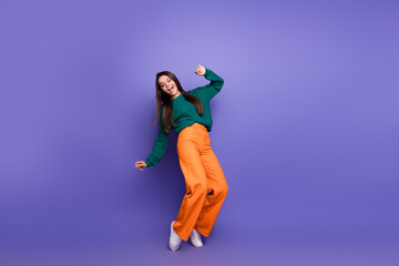 Full size photo of nice young girl dance tiptoes empty spaceisolated on purple color background