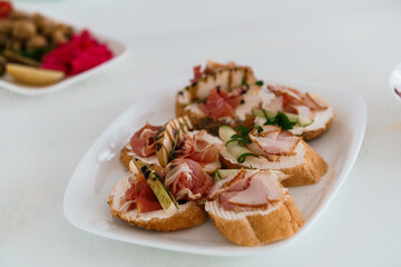 Assorted Gourmet Crostini with Charcuterie and Fresh Ingredients