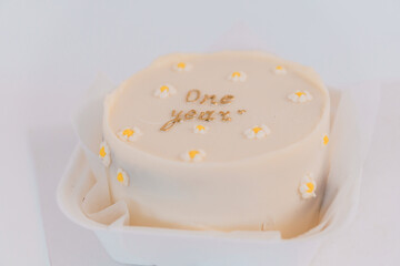 Elegant One-Year Birthday Cake with Delicate Floral Decor