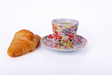 Delicious croissants and coffee on a light marble table, showcasing a simple breakfast moment in a cozy setting, perfect for a casual morning meal