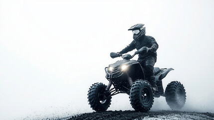 A rider skillfully navigates a quad bike on a muddy terrain against a stark white background during a thrilling outdoor adventure