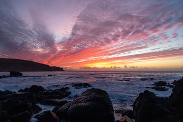 Winter sunset over the ocean at the Gauldrons Beach, Scotland