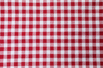 Tablecloth with checkered pattern as background, top view