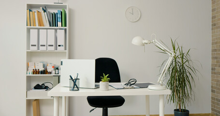Medical office in a hospital. Modern room for doctor to check patients in white colour.