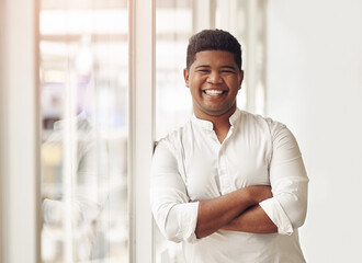 Man, portrait and arms crossed in office, employee and proud project manager in Mexico. Male person, professional and leader of development in company mission, business commitment and ambition drive