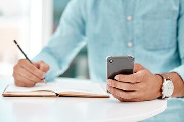 Hands, writing and book with phone in office with checklist, feedback or search for info at startup...