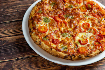 Vegetarian pizza on wooden background