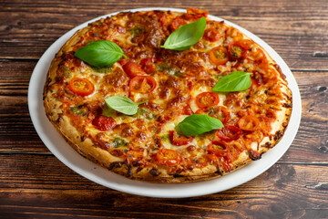Vegetarian pizza on wooden background