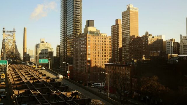 View of urban cityscape with highrise buildings and bridge in the morning light