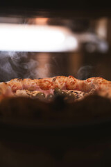 A pizza is seen baking inside a stone oven, with the crust slowly rising to a perfect golden brown. Ideal for bakeries, pizzerias, or food-focused campaigns...