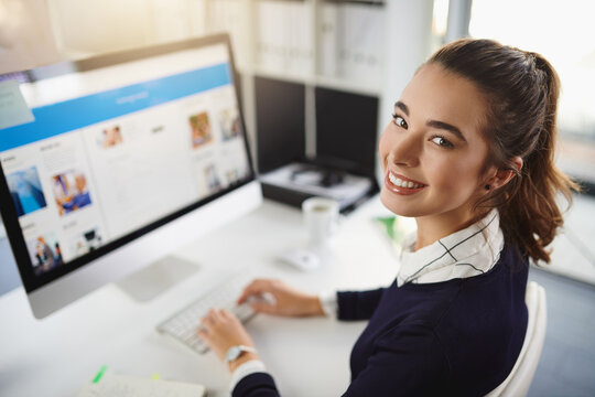 Woman, happy and typing in portrait, office and startup with website, copywriting and editing at media company. Person, writer and smile with pc, screen and excited at creative agency in Italy