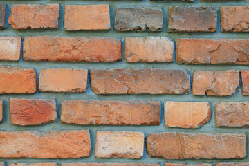 Obraz premium A brick wall with a brown and tan color