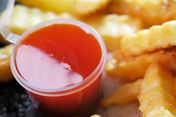 Dipped crinkle fries with chilli sauce