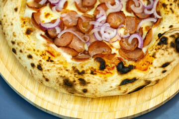 Traditional rustic artisanal pepperoni and onion pizza. Calabresa sausage pizza