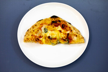 Traditional rustic pizza made with four cheeses, garlic and oil and pear with gorgonzola