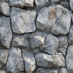 A close-up view of textured stone wall made of irregularly shaped rocks.
