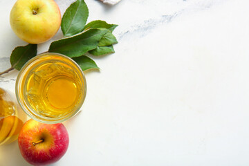 Composition with fruits and glass of fresh apple cider on marble background