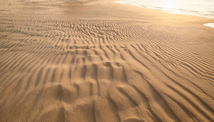 Fototapeta na wymiar Smooth Background of Beige Beach Sand with Natural Texture
