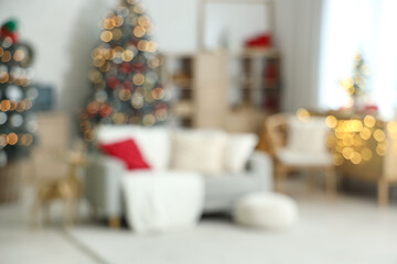 Interior of living room decorated for Christmas with sofa, blurred view