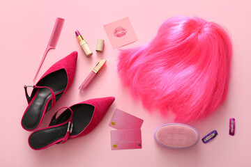Composition with stylish female wig, shoes, accessories and gift cards on pink background