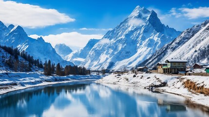 Scenic winter landscape with mountains and a reflective river.