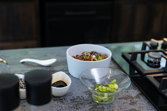 Preparing delicious dish with fresh ingredients in modern kitchen, at home