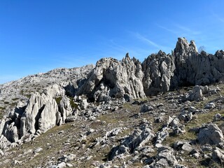 Rocky ridge of Tulove grede or karst mountain peak of Tulovice - Velebit Nature Park, Croatia (Stjenoviti greben Tulove grede ili krški planinski vrh Tulovice - Park prirode Velebit, Hrvatska)