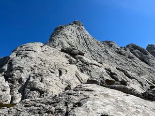 Rocky ridge of Tulove grede or karst mountain peak of Tulovice - Velebit Nature Park, Croatia (Stjenoviti greben Tulove grede ili krški planinski vrh Tulovice - Park prirode Velebit, Hrvatska)