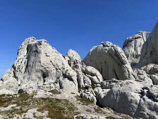Rocky ridge of Tulove grede or karst mountain peak of Tulovice - Velebit Nature Park, Croatia (Stjenoviti greben Tulove grede ili krški planinski vrh Tulovice - Park prirode Velebit, Hrvatska)