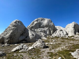 Rocky ridge of Tulove grede or karst mountain peak of Tulovice - Velebit Nature Park, Croatia (Stjenoviti greben Tulove grede ili krški planinski vrh Tulovice - Park prirode Velebit, Hrvatska)