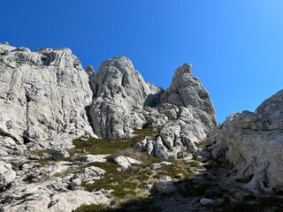 Rocky ridge of Tulove grede or karst mountain peak of Tulovice - Velebit Nature Park, Croatia (Stjenoviti greben Tulove grede ili krški planinski vrh Tulovice - Park prirode Velebit, Hrvatska)