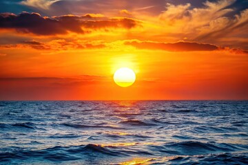 Scenic sunset over ocean with sun in sky