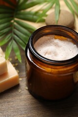 Spa composition with different cosmetic products on wooden table, closeup