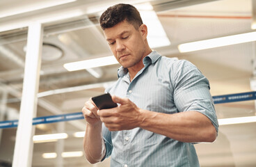 Man, phone and typing email in office, reading notification and journalist online for column quote....