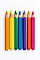 Fototapeta premium A vibrant assortment of colored pencils in a rainbow spectrum arranged neatly on a white background.