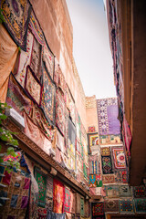 Carpets on the walls outside the terracotta houses in Kashgar Old Town, Xinjiang, China
