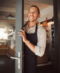 Happy, man and business owner at entrance of cafe with welcome, customer service and hospitality...
