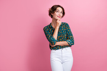 Photo of intelligent pretty girl dressed print shirt hand on chin look at business idea empty space...