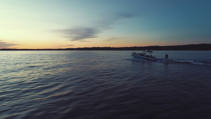 sunset over the lake wakesurfing