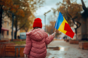 Child Holding a Flag Celebrating Great Union Day in Romania. Romanian girl celebrating the national day on December 1st
