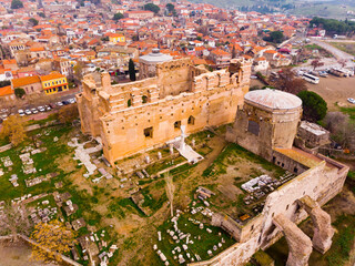 View from drone of notable ruins of Red Basilica on background of Bergama cityscape in winter day,...