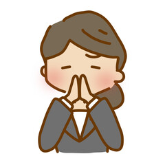 両手を合わせてお願いしているゆるくて可愛いスーツの女性