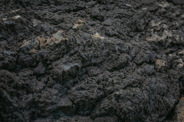 Surface of dark mountain. Space for text. Close-up. Background.