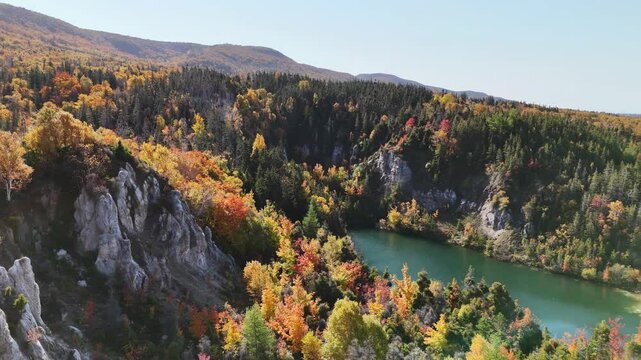 Aerial view of Gypsum Lake in Cape Breton Nova Scotia during Autumn.  Fall foliage of the mountains with multi colored deciduous trees, La Prairie, Cabot Trail, Cape Breton. 