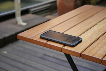 forget smartphone on a cafe table , lost smart phone 