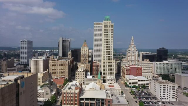 Tulsa, Oklahoma, USA - June 25, 2023: Afternoon sun shines on historic buildings of downtown Tulsa.